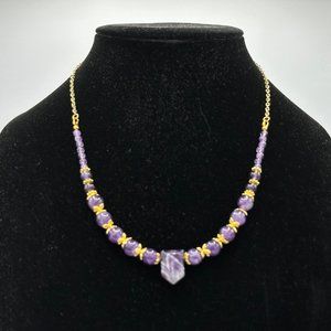 Amethyst gem beads with faceted pendant.